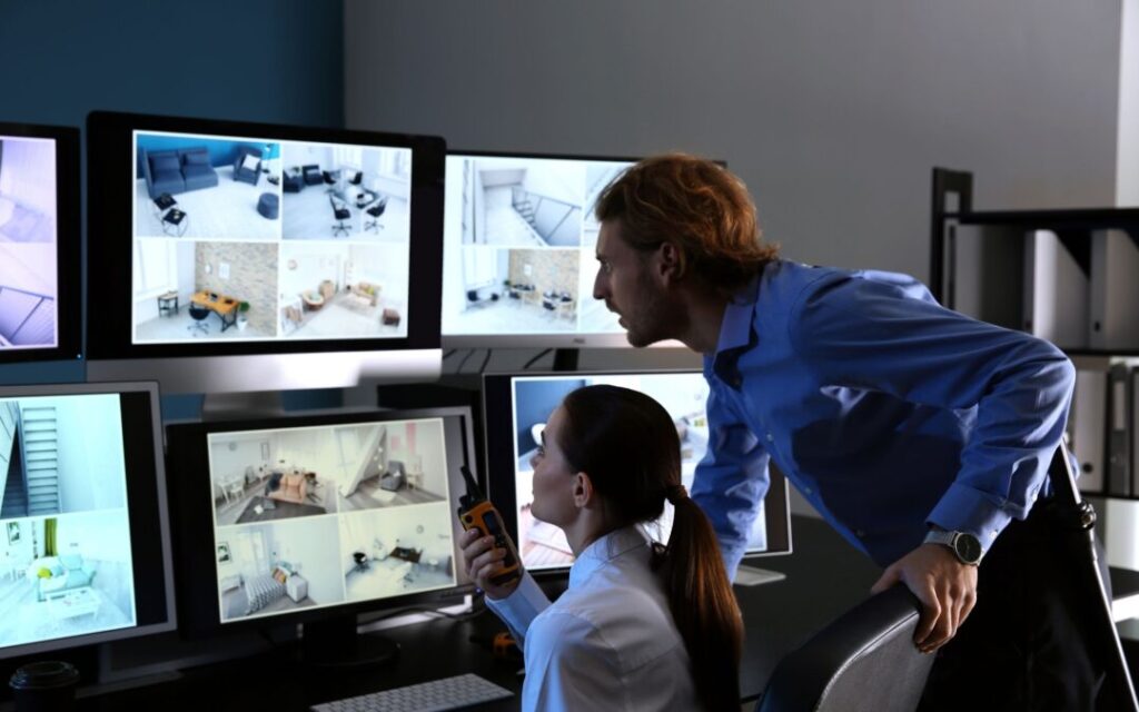 Man and Woman Watching Monitor